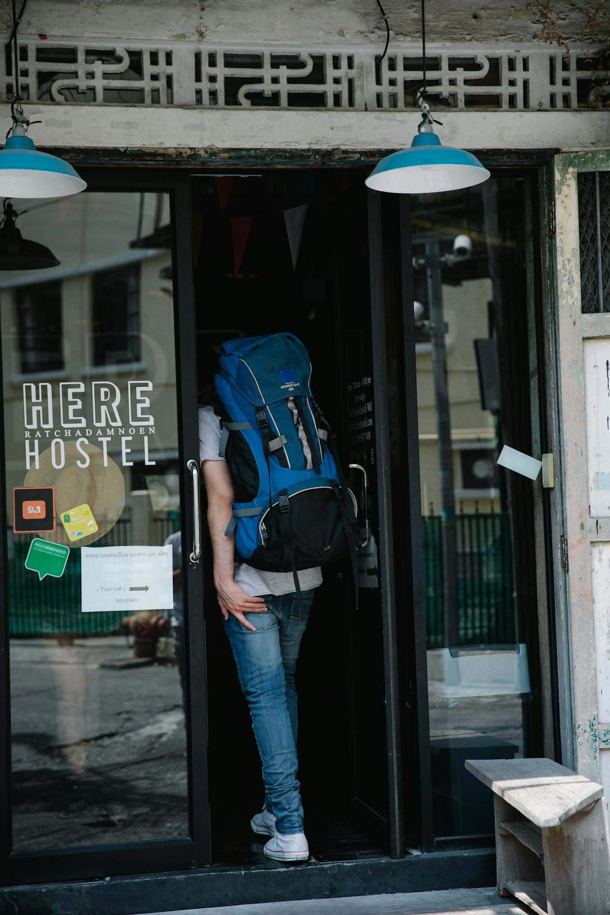 A budget-friendly hostel dorm in Scotland with backpackers planning their route